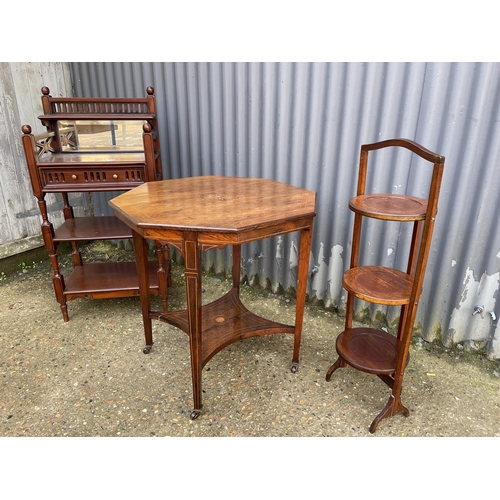 171 - A reproduction whatnot, inlaid centre table and a cake stand