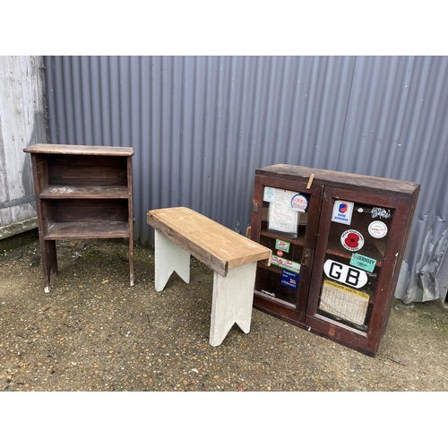 18 - A vintage painted pine bench together with a vintage pine book shelf and a cabinet (glass af )