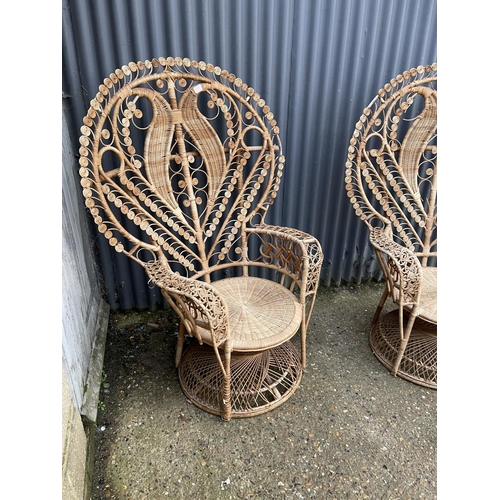 181 - A pair of large wicker 'peacock' chairs with heart shape to the back