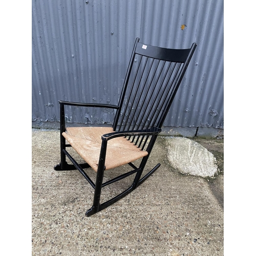 207 - A danish design black painted rocker chair with rush seat