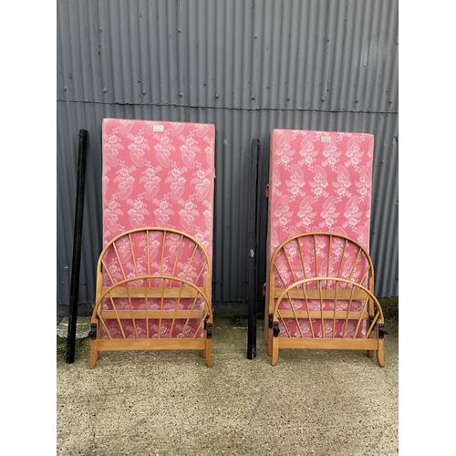 209 - A pair of early ercol light elm single bed frames with drop in divan bases