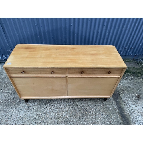 210 - A mid century teak sideboard by GORDON RUSSELL, labelled to the reverse RUSSELL OF BROADWAY 140x40x8... 