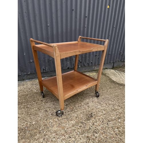 211 - A mid century teak tea trolley labelled JOHN FIRTH HONEYBOURNE