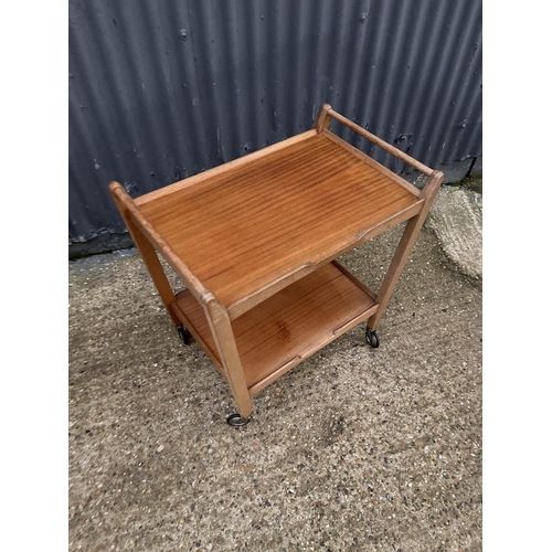 211 - A mid century teak tea trolley labelled JOHN FIRTH HONEYBOURNE