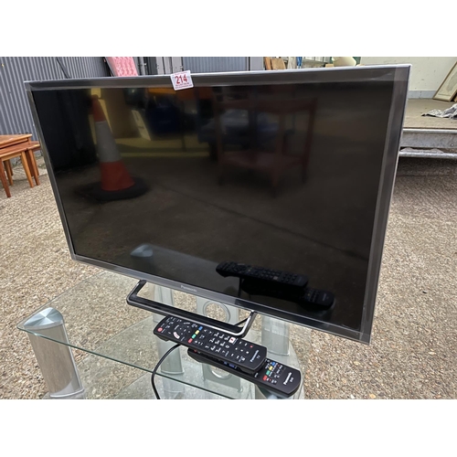 214 - A Panasonic tv on clear glass stand with remote