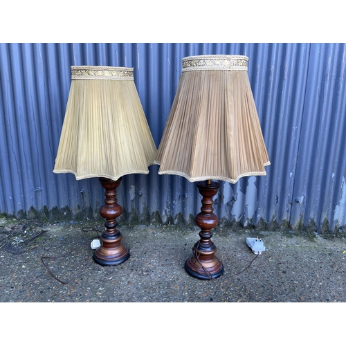 224 - A pair of wooden table lamps with shades 80cm high