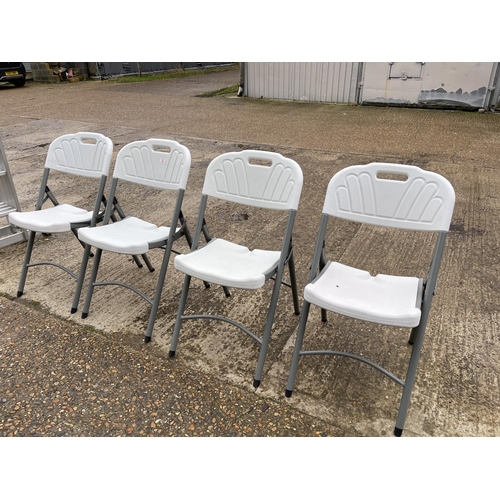 23 - A set of four modern folding chairs