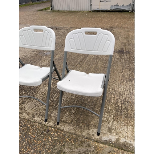 23 - A set of four modern folding chairs