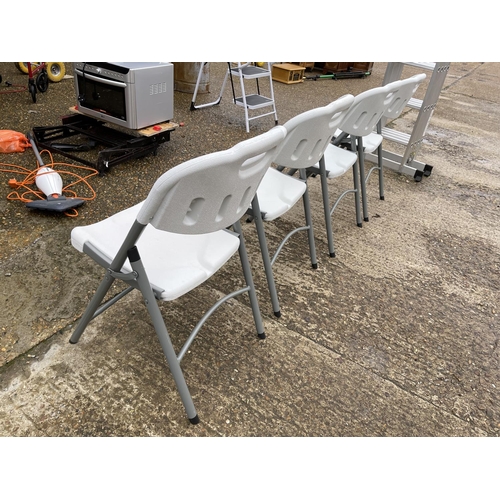 23 - A set of four modern folding chairs