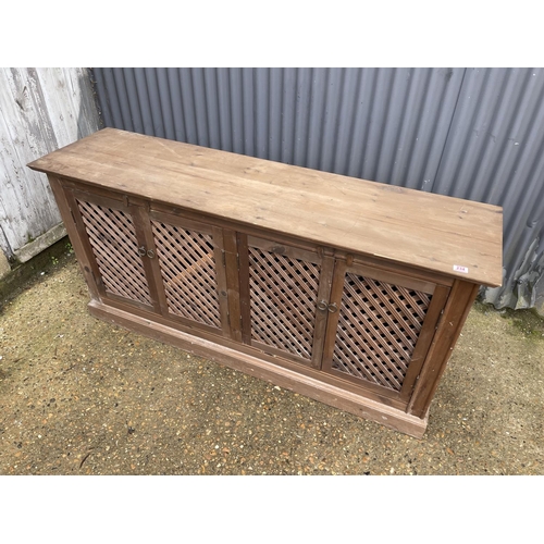 234 - A pine sideboard with four lattice doors 175x45x88