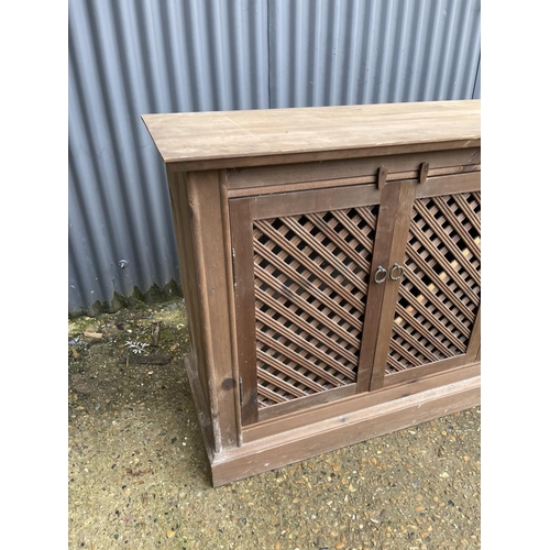 234 - A pine sideboard with four lattice doors 175x45x88