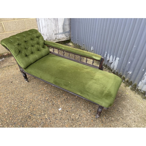 235 - An Edwardian green upholstered chaise lounge 170cm