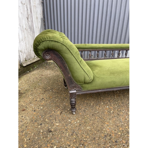 235 - An Edwardian green upholstered chaise lounge 170cm