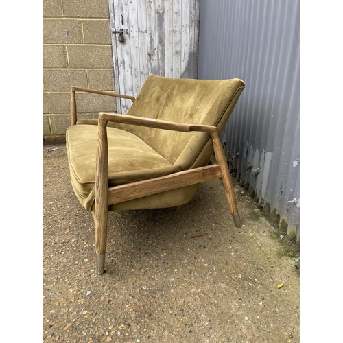 237 - A modern green upholstered two seater love seat 150cm wide