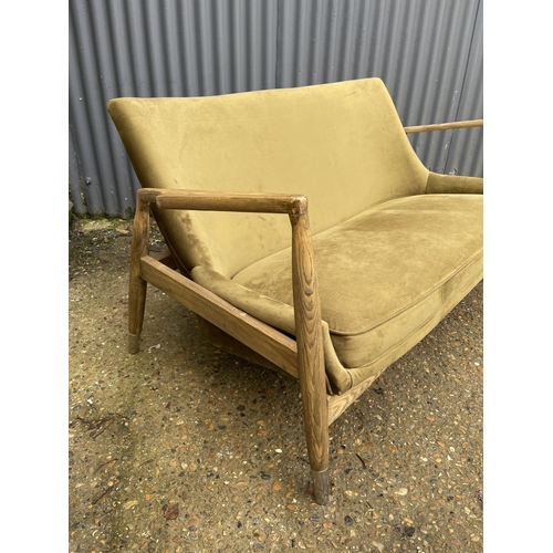 237 - A modern green upholstered two seater love seat 150cm wide