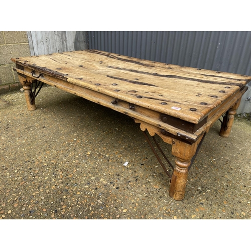 238 - A large driftwood coffee table with iron stud decoration 180x97x50