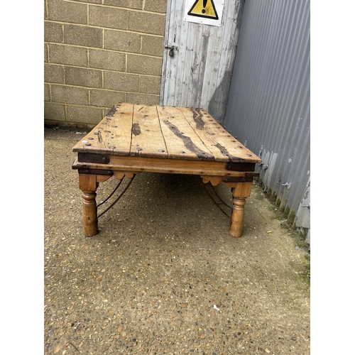 238 - A large driftwood coffee table with iron stud decoration 180x97x50