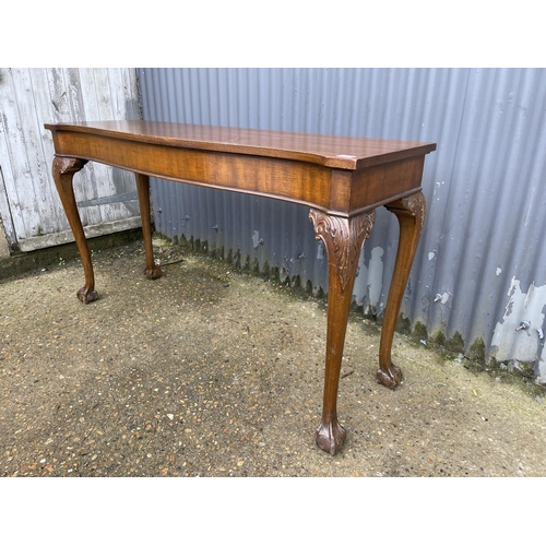 241 - A long mahogany side / serving table on ball and claw feet 153x 45 x86