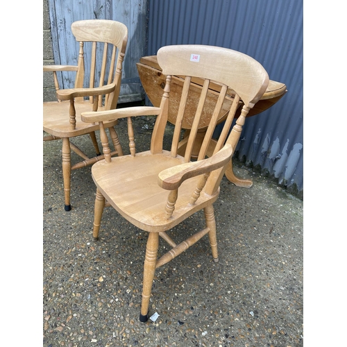 248 - A pair of solid pine carver chairs together with a drop leaf kitchen table