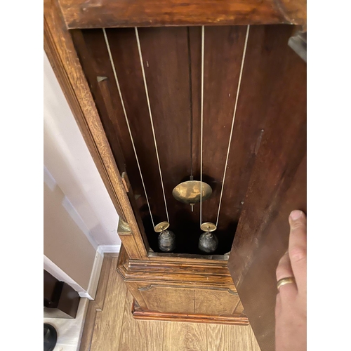 263 - An oak caxed longcase clock with brass dial