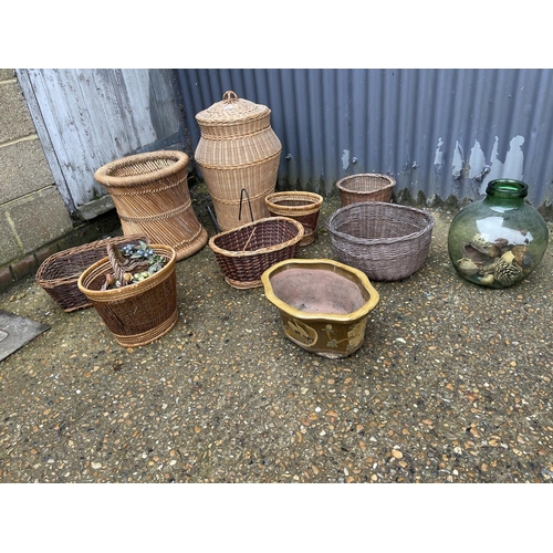 3 - 8 pieces of basket-ware, a glass carboy and a ceramic planter