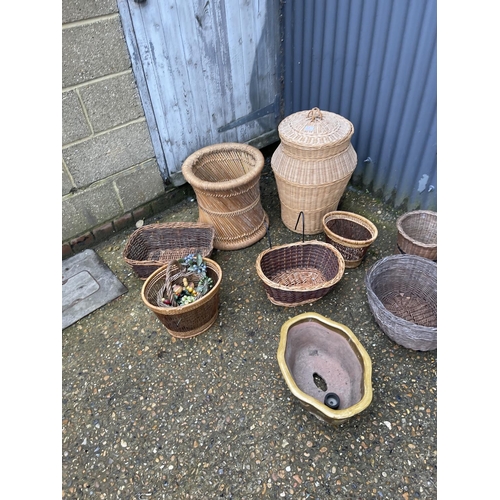 3 - 8 pieces of basket-ware, a glass carboy and a ceramic planter