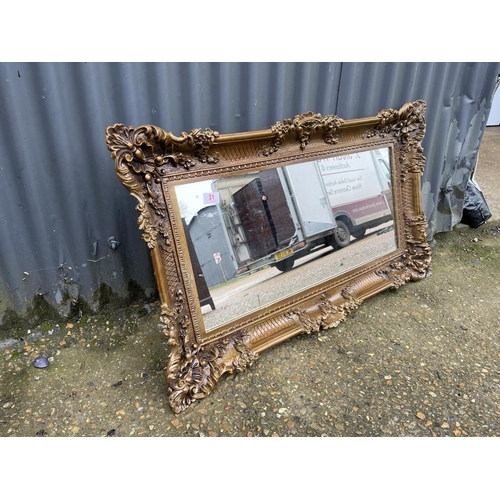 31 - A gold gilt framed mirror 95x60