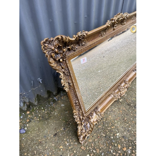 31 - A gold gilt framed mirror 95x60