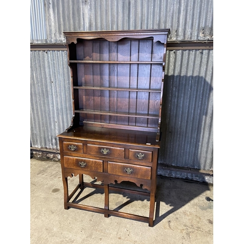 323 - A good quality reproduction oak dresser by Titchmarsh & Godwin or similar, removable plate rack top ... 