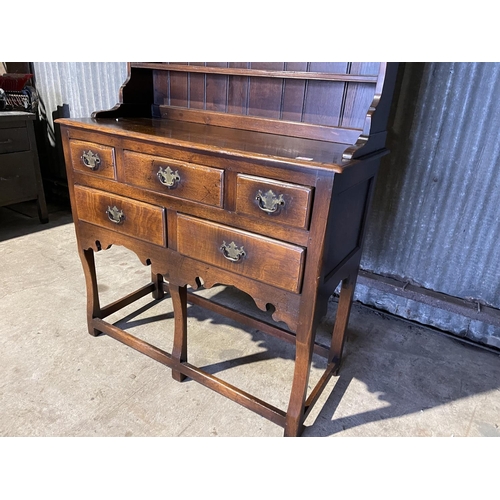 323 - A good quality reproduction oak dresser by Titchmarsh & Godwin or similar, removable plate rack top ... 