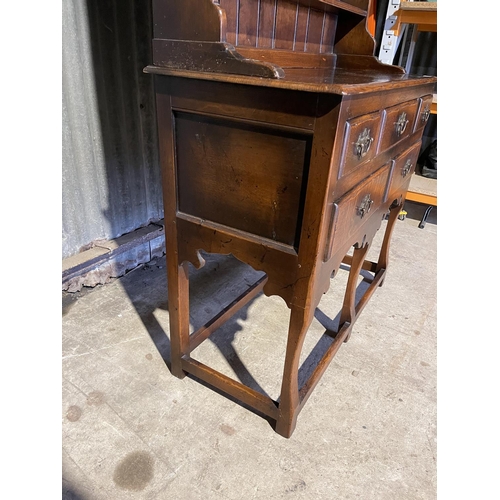 323 - A good quality reproduction oak dresser by Titchmarsh & Godwin or similar, removable plate rack top ... 