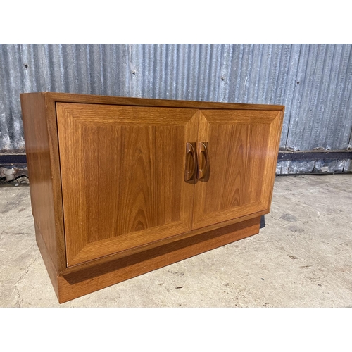 325 - A small g plan teak two door sideboard base unit