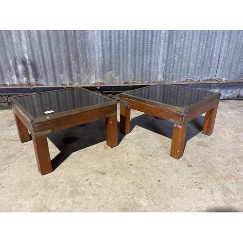 326 - A pair of reproduction military style side tables with brass edge and glass tops