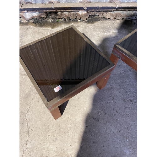 326 - A pair of reproduction military style side tables with brass edge and glass tops