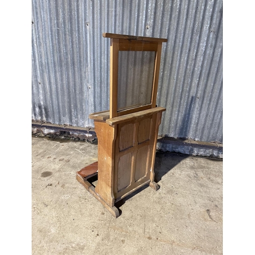 327 - A vintage oak chapel confessional kneeler, with rose and fall mesh screen