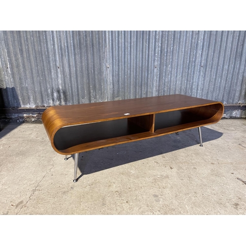 328 - A large modernist oval form coffee table with chrome legs 148 x 50x 46