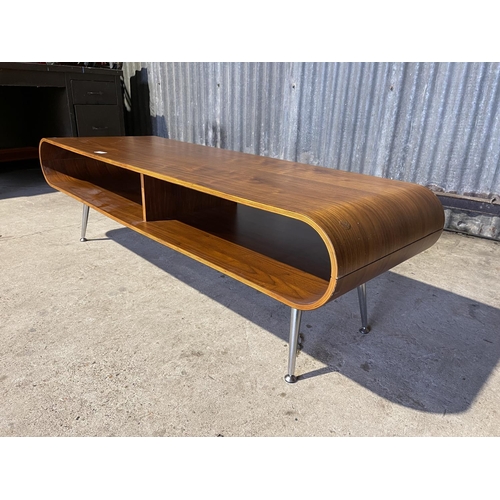 328 - A large modernist oval form coffee table with chrome legs 148 x 50x 46