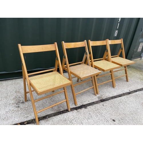 332 - A set of four folding chairs with begere seats