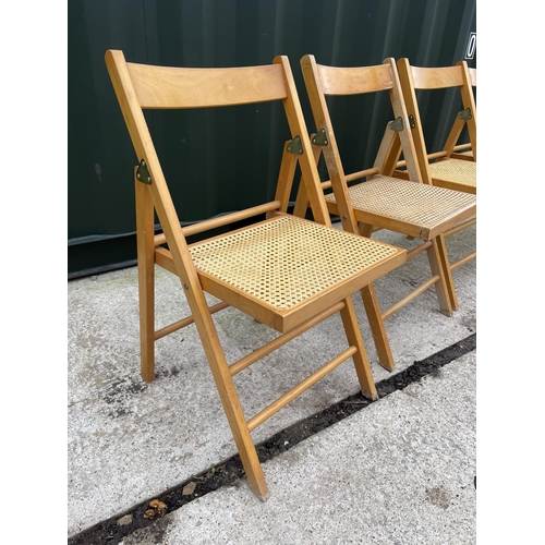 332 - A set of four folding chairs with begere seats