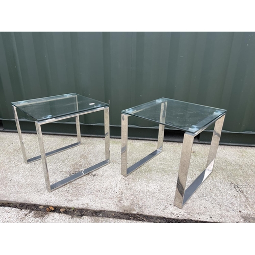 337 - A pair of modern glass and chrome lamp tabes