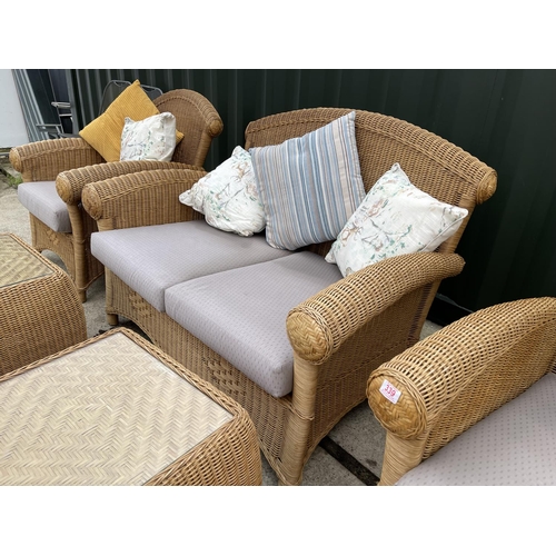 339 - A MODERN wicker five piece conservatory suite by RATANCRAFT consisting of a sofa, two chairs and two... 