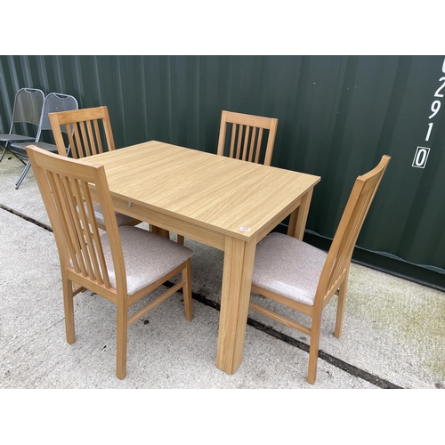 340 - A modern beechwood effect extending dining table together with 4 matching chairs by Caxton furniture... 