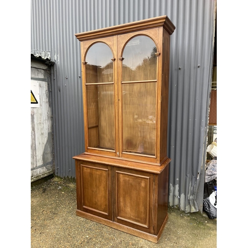 38 - A large Edwardian mahogany glazed bookcase cupboard with four glass adjustable shelves   120x50x 233