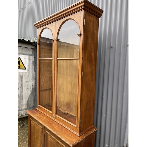 38 - A large Edwardian mahogany glazed bookcase cupboard with four glass adjustable shelves   120x50x 233