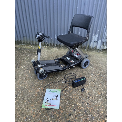 50 - A folding  luggie folding scooter with charger and manual