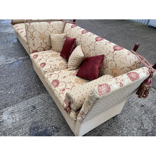 54 - A pair of grand red and gold pattern drop end Knoll sofas with associated bolster and scatter cushio... 