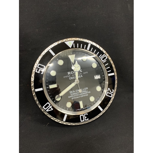 557 - Rolex dealer Seadweller wall clock, diameter 34cms