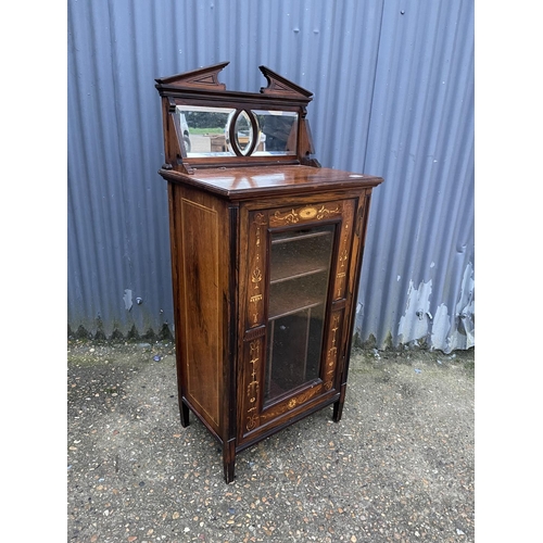 56 - An Edwardian inlaid mahogany music cabinet