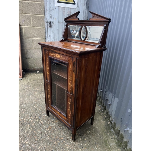 56 - An Edwardian inlaid mahogany music cabinet