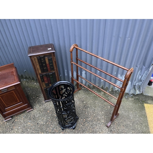 58 - A metal umbrella stand together with an airer, a book effect cupboard and an inlaid coal box